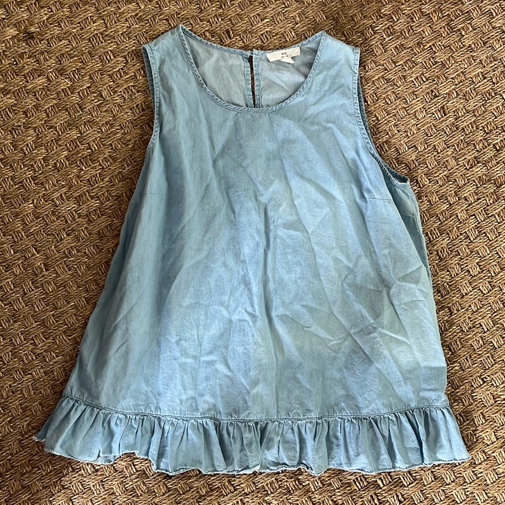 Sleeveless ruffle hem blouse